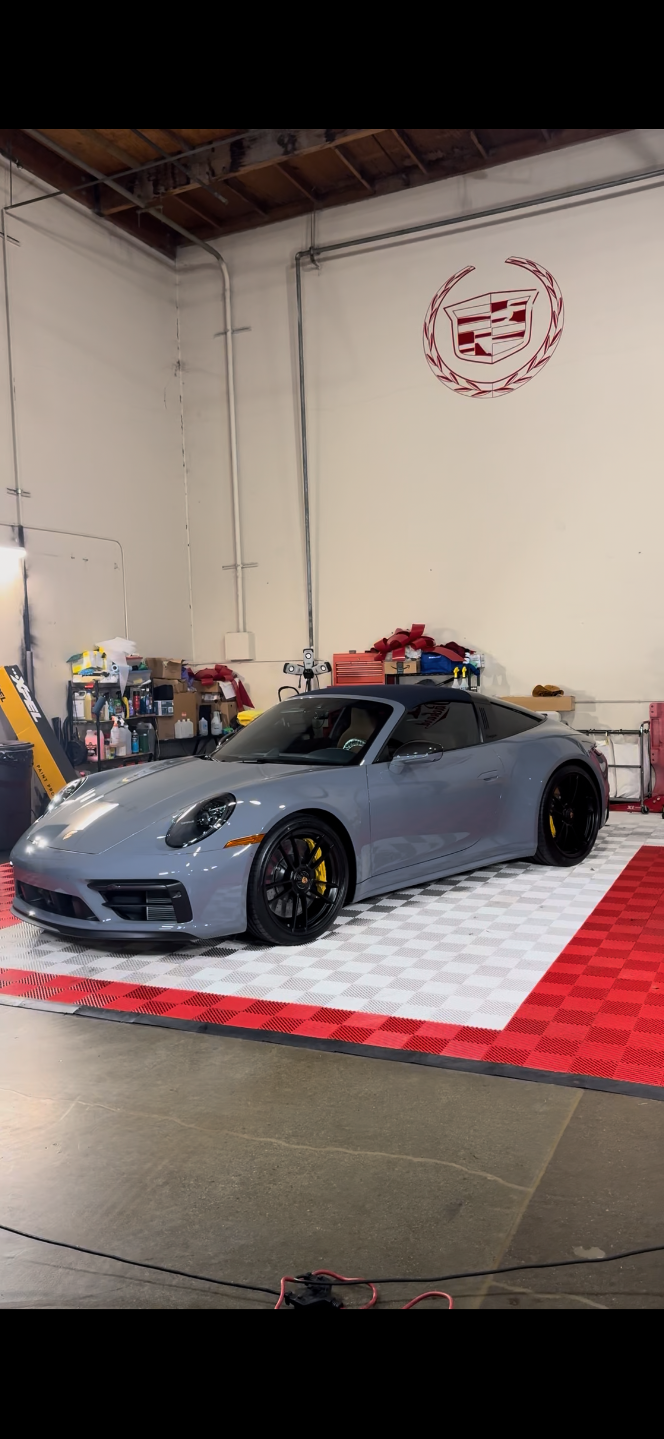 Grey Porsche 911 convertible with yellow calipers