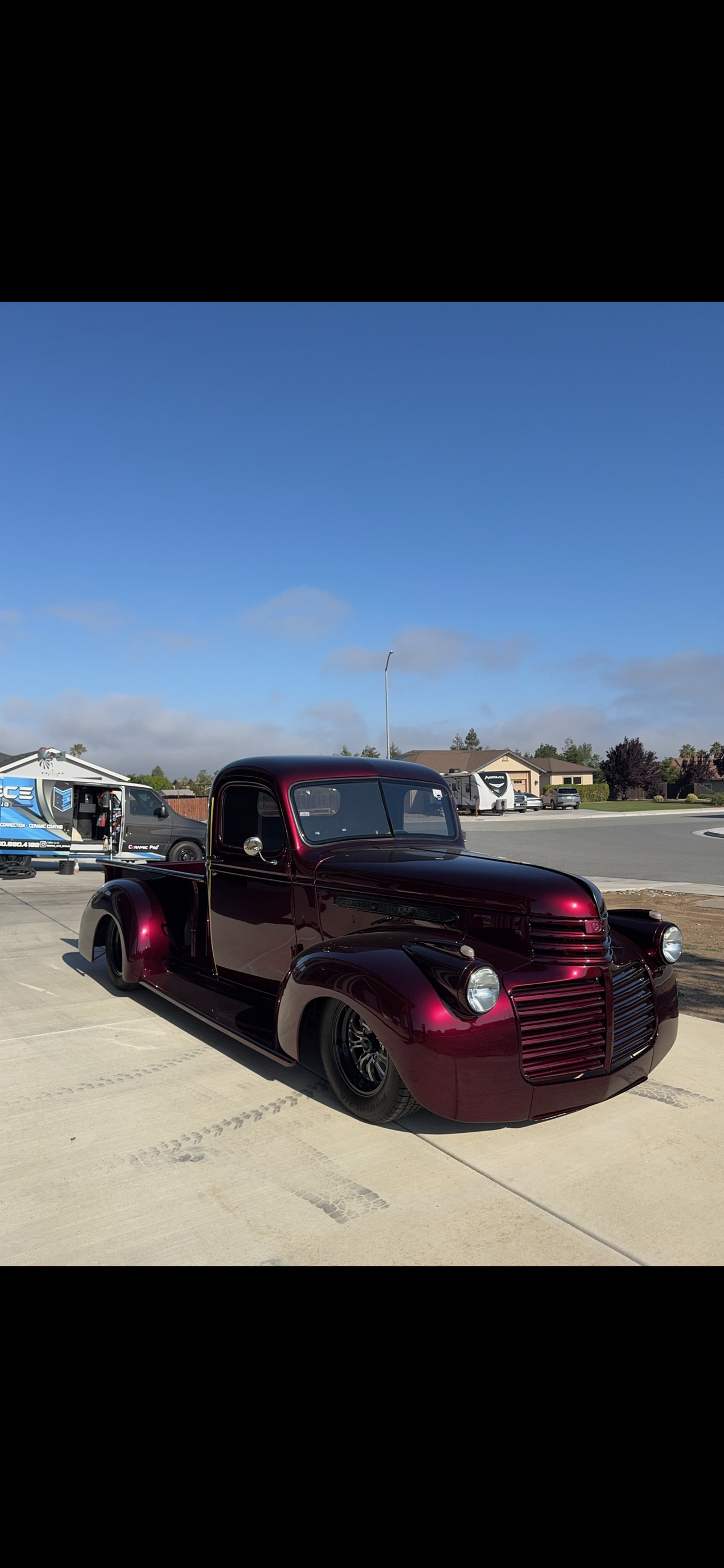 Custom vintage pickup truck with deep glossy black cherry paint finish
