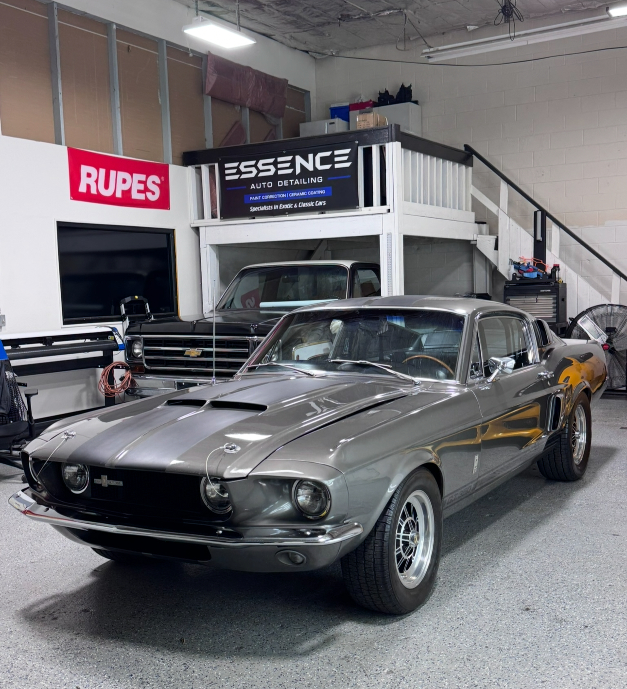 Grey Ford Mustang fastback in the detailing bay
