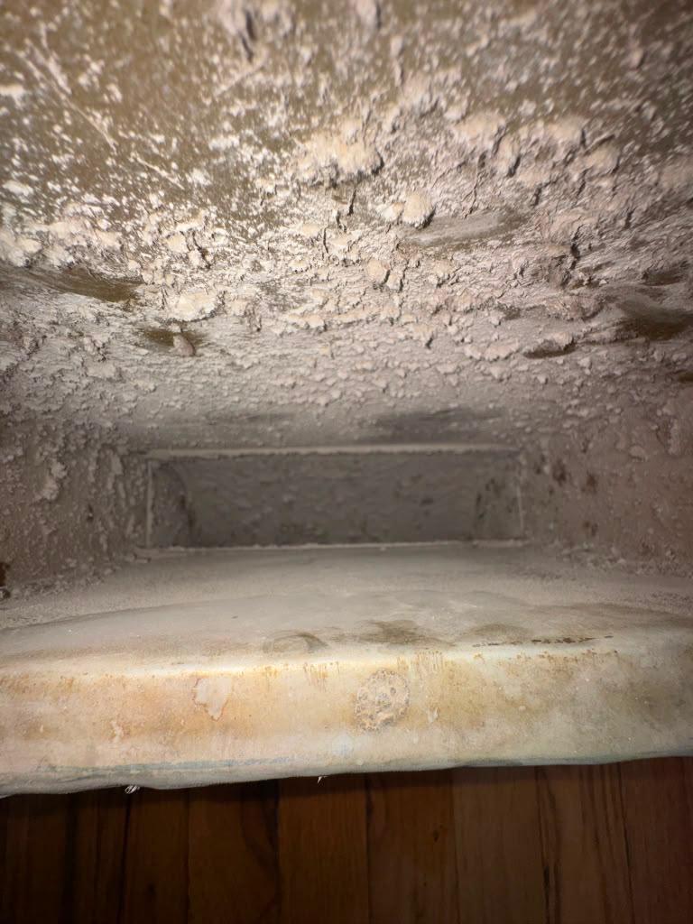 Air duct cleaning job from a Summit service van.