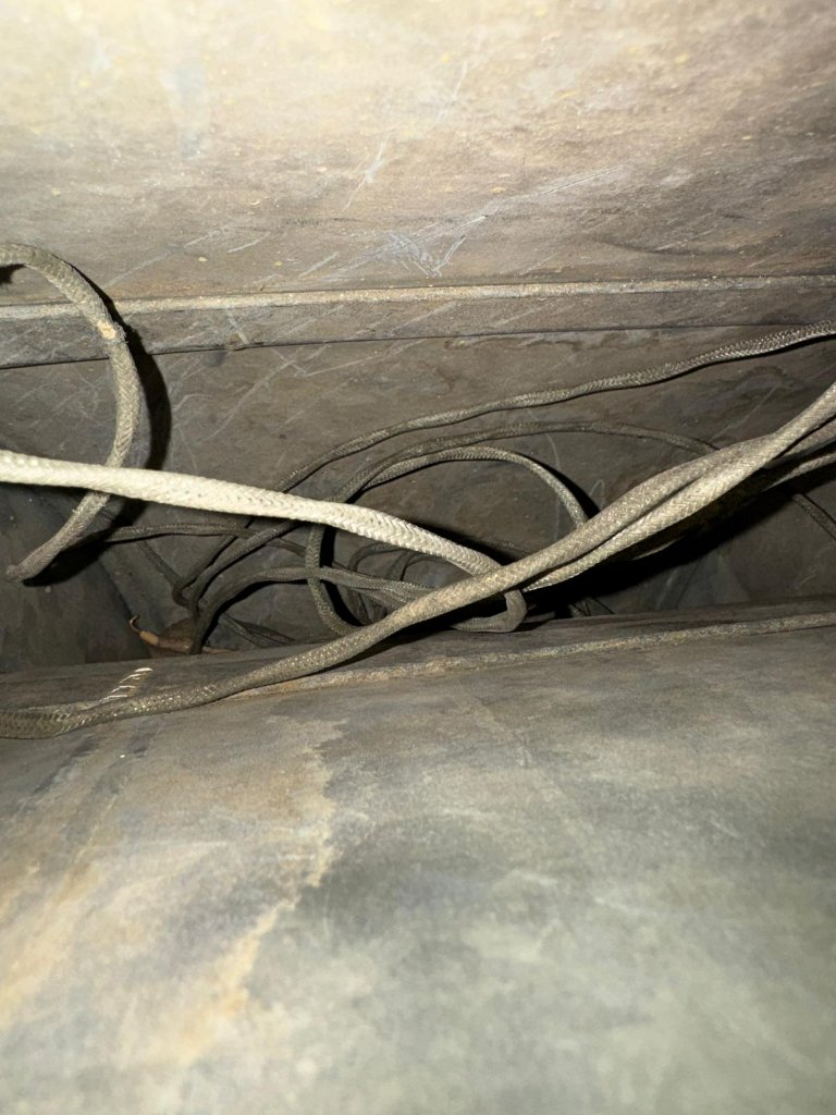 Air duct interior after cleaning, with debris removed.