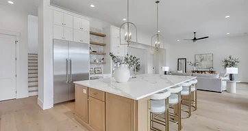 Open-concept kitchen and living room with a large island