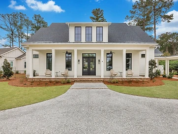 Front of a white two-story home with a full-width porch and a wide drive