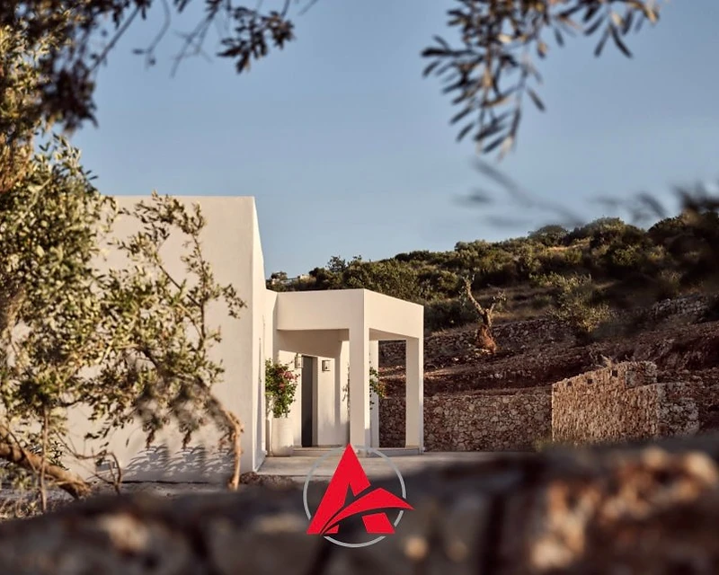 Luxury modern Greek villa overlooking the Aegean at dusk — Arapis Construction