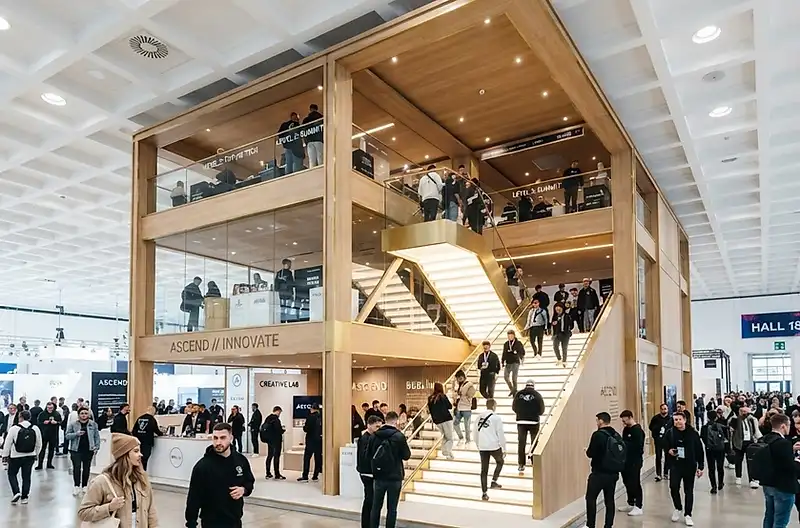 Multi-level walk-in brand pavilion inside the expo hall