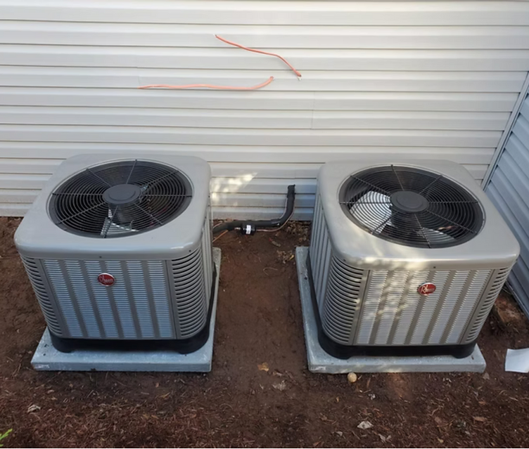 Newly installed central air condenser units outside a New Jersey home