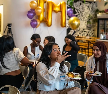 Community members celebrating together at an Empower'em event