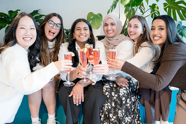 The Empower'em team together at a Deeply Rooted event