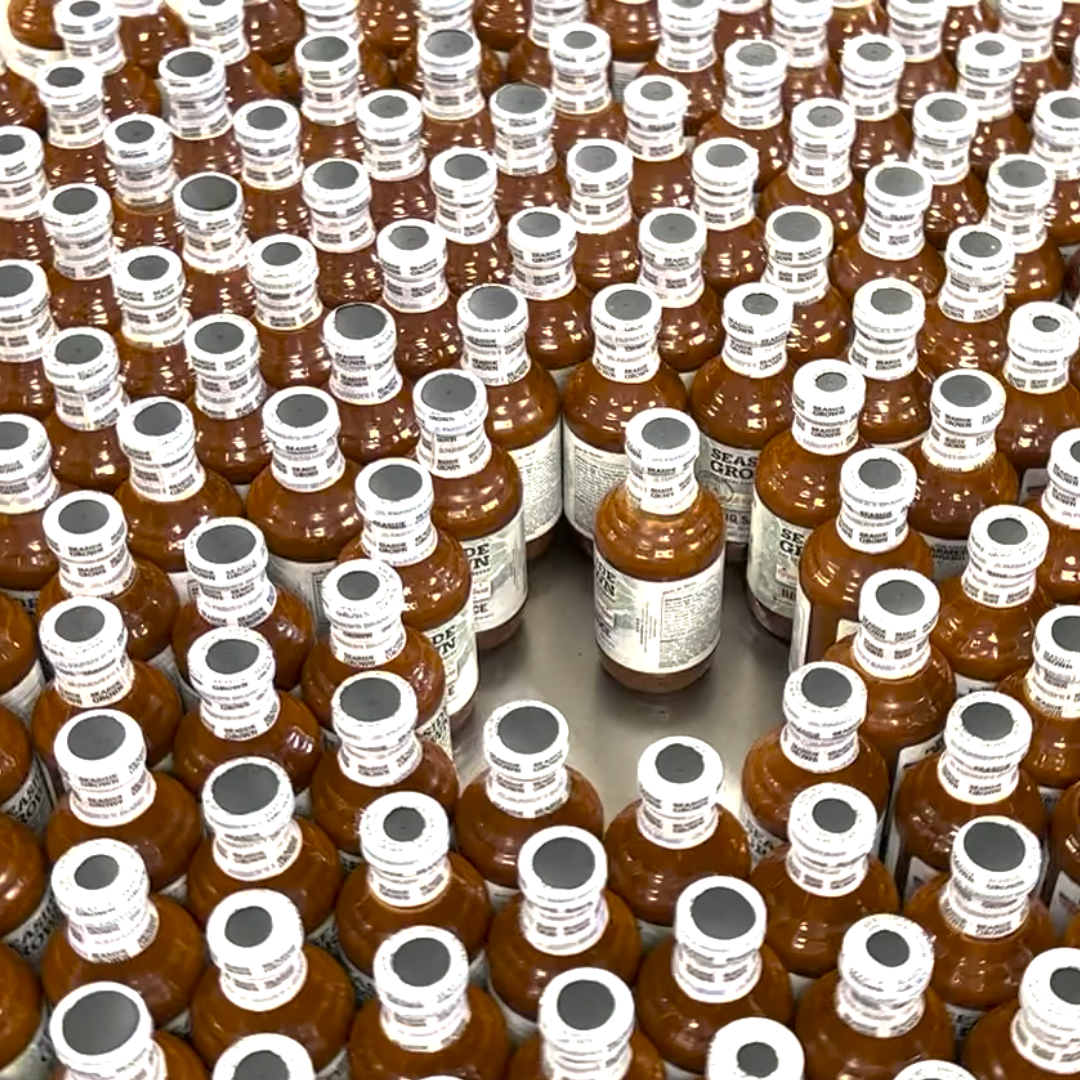Capped, labeled bottles ready for casing
