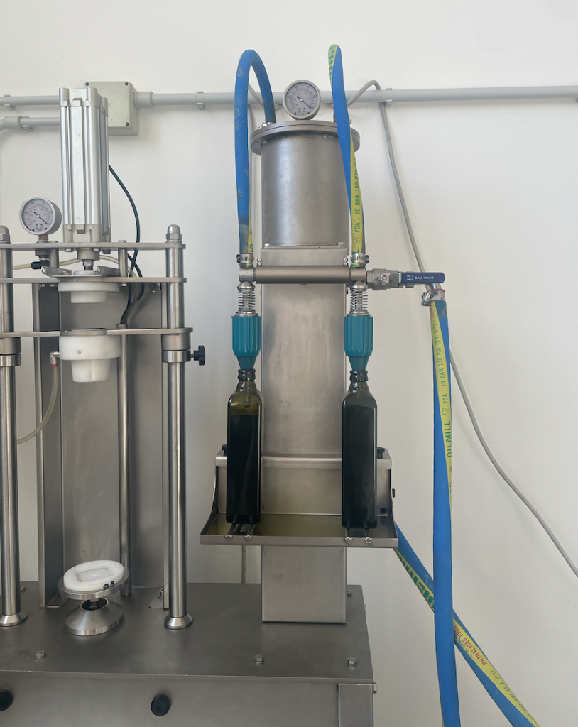 Industrial bottling machine filling dark glass bottles