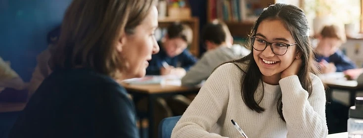 Student receiving support in a warm classroom setting