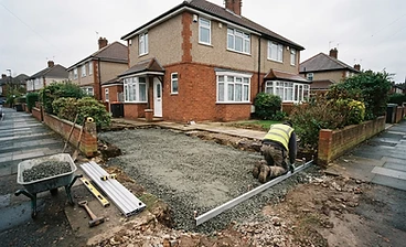 Driveway groundwork with compacted sub-base and edging