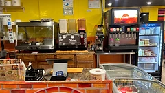 Service counter area with beverage station and refrigerators