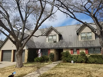 Home exterior with siding and brick being painted, residential exterior painting in Odessa, TX