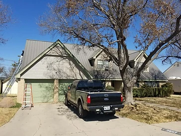 Home with tan siding being repainted, residential exterior painting in Midland, TX
