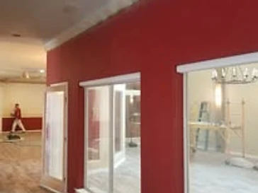 Room with deep red accent wall, residential interior painting in Odessa, TX