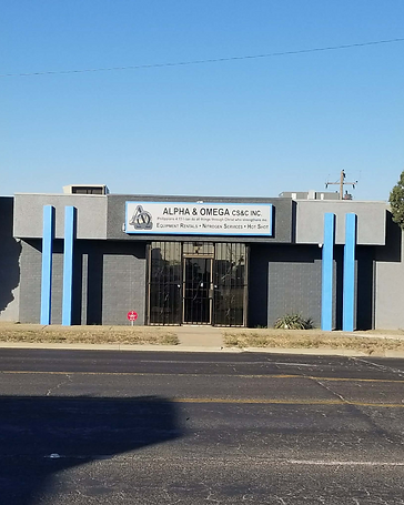 Commercial facility with painted exterior and blue accent pillars, commercial exterior painting in Odessa, TX