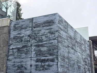 Before — weathered stone water feature wall