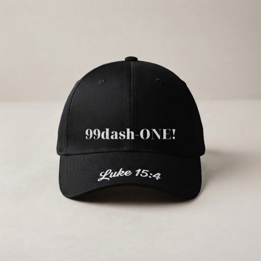 The 99dash-ONE! Cap - black cap with white wordmark and Luke 15:4 on the visor