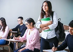 Young adults learning together in a classroom