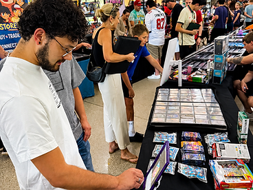Customer browsing the display case on a tablet mounted to a kiosk stand at a card show