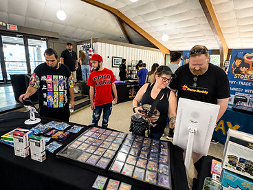 Vendors and customers transacting with the app on a tablet and kiosk terminal at a card event