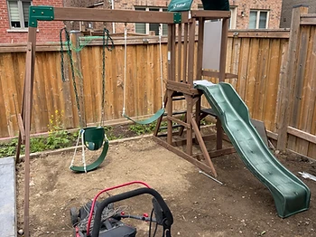 KidKraft swing set installed on grass / ground in Brampton, Ontario — photo 2