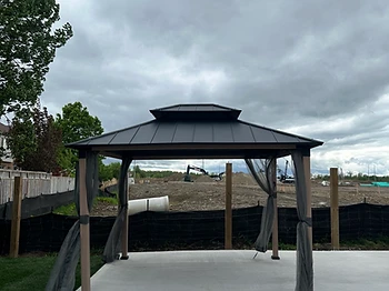 Hampton Bay 10×12 gazebo installed on concrete in Hamilton, Ontario — photo 1