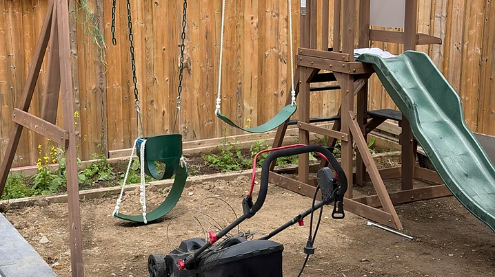 KidKraft swing set installed on grass / ground in Brampton, Ontario