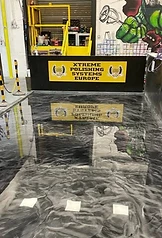 High-gloss metallic epoxy polished concrete floor finish by Xtreme Polishing Systems
