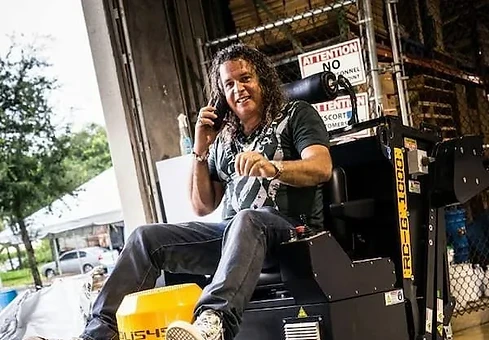 Chris Lavin on a floor grinder