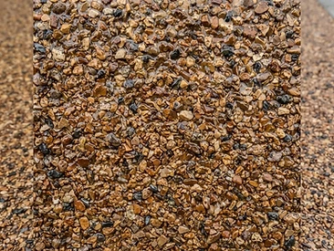 Autumn Stone resin-bound aggregate close-up showing natural washed stone in clear resin
