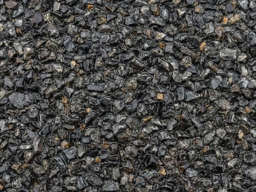 Dark Flint resin-bound aggregate close-up showing natural washed stone in clear resin