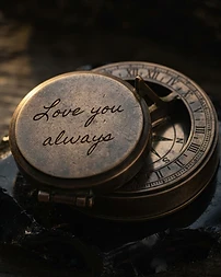 Handwriting engraving on an engraved brass compass lid