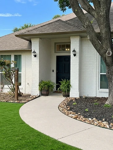 white brick exterior home freshly painted