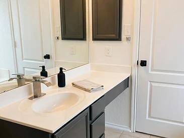 bathroom cabinets painted with a dark red finish