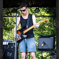 Guitarist playing a sunburst Telecaster on stage