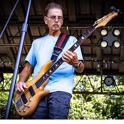 Bass player performing live on the gazebo stage