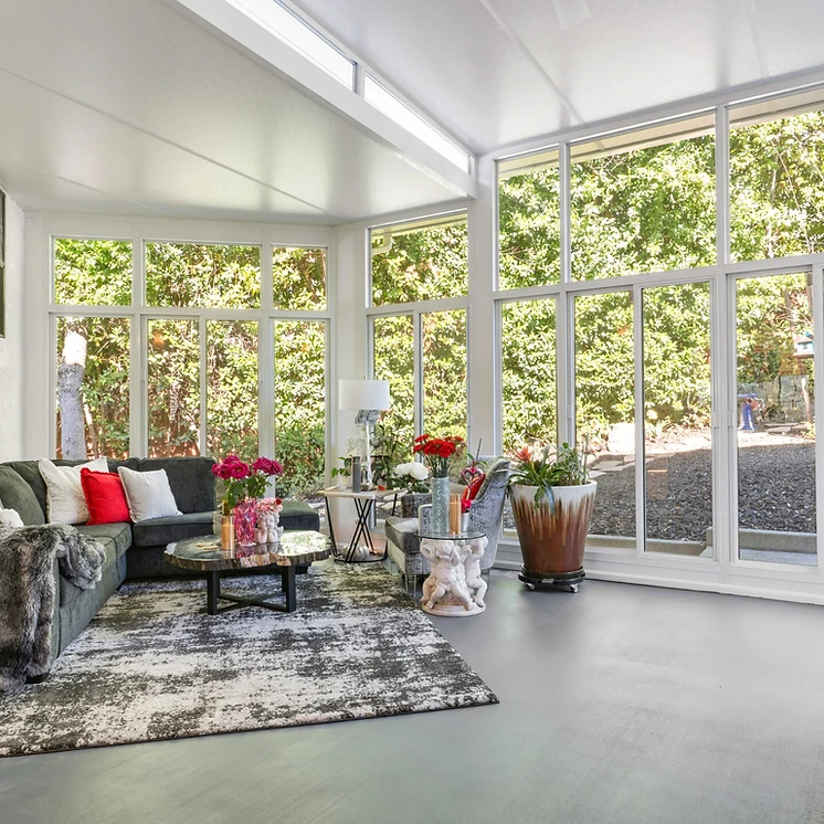 Modern enclosed sunroom with panoramic glass walls in Murrieta, CA
