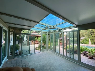 Sunroom interior with polycarbonate roof and open walls