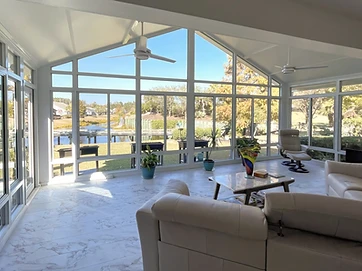 Enclosed glass sunroom with cathedral design