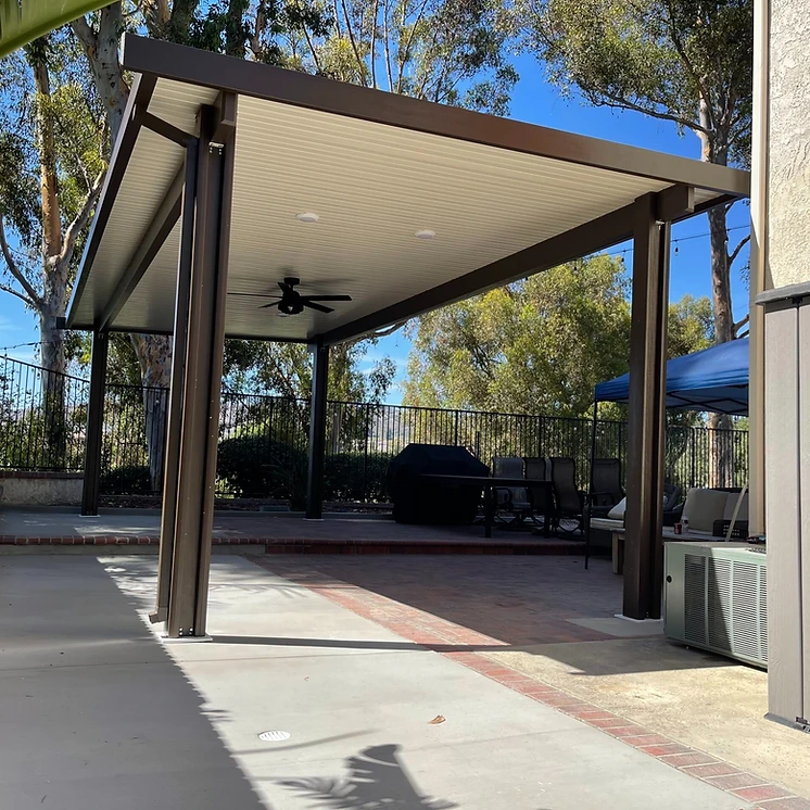 Solid aluminum attached patio cover with ceiling fan in Temecula, CA