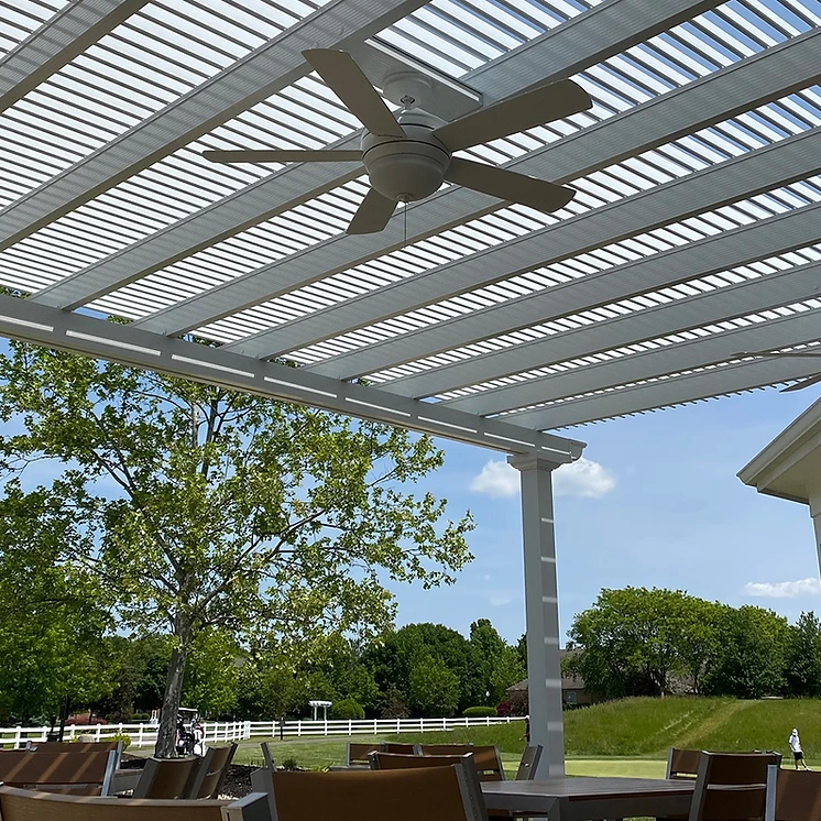 Louvered pergola providing adjustable shade