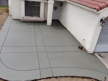 Newly poured smooth concrete driveway with expansion joints
