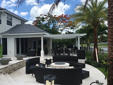 Custom patio with sitting area and wood-style patio cover