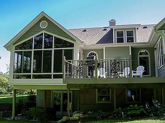 Elevated deck sunroom addition on two-story home