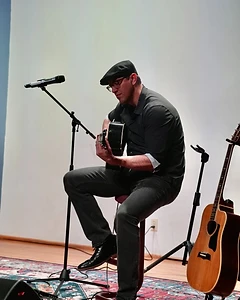 James on guitar library stage