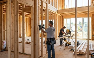 Illustrative photo of a home under construction with wood framing