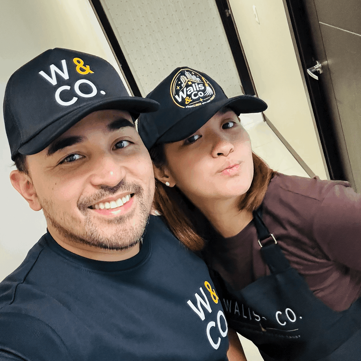 Two members of the Walis & Co. cleaning crew in branded uniform in Las Vegas