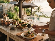 A private chef plating a refined dish at an open-air Koh Samui villa kitchen at golden hour